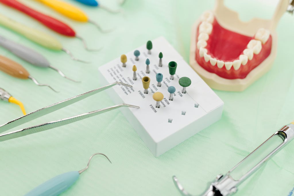 Close-up image of dental tools and model teeth for professional dentistry setup.